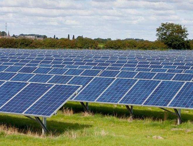 Ground-mounted solar farm with rows of photovoltaic panels
